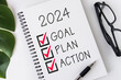 © Yusnizam Yusof - 2024 Goal, Plan, Action checklist text on note pad with glasses and pen.