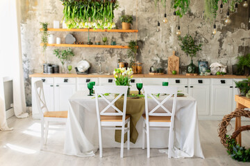 Wall Mural - Interior design scandinavian kitchen with table and chair. Cozy Wooden white cuisine decorated with flowers and decor. Kitchen utensils, dishes, plates on shelves. Stylish dining room with furniture	