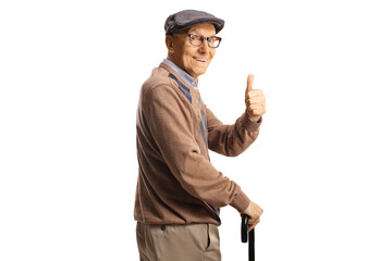 Happy senior man with a cane looking over shoulder and gesturing thumbs up