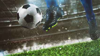 Football scene at night match with close up of a soccer shoe hitting the ball with power