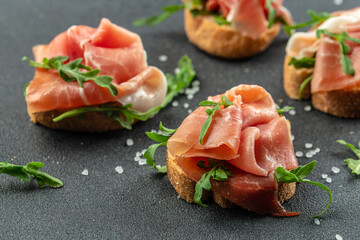 Wall Mural - delicious toasts jamon. Spain tapas. Food recipe background. Close up