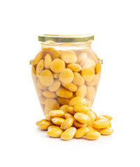 Poster - Lupini beans in brine. Pickled lupin in jar isolated on white background.