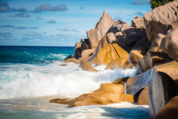 Wall Mural - Big granite rocks on the Grand Anse beach. La Digue island, Seychelles. Tropical landscape with sunny sky.