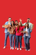 © Pixel-Shot - Group of friends with tasty pizza on red background
