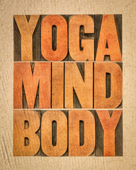 yoga, mind, body word abstract - text in letterpress wood type on handmade paper, meditation, wellne