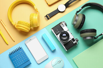 Wall Mural - composition with different gadgets and stationery on color background