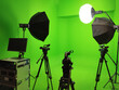 canvas print picture - A green screen studio room used to record footage and content is equipped with a video camera and lighting system.