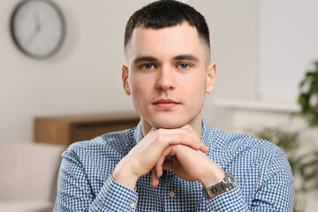 Poster - Young man having online video call at home, view from web camera