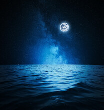 Picturesque Starry Sky With Full Moon Over Sea At Night