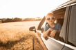 © kieferpix - Happy child boy sitting in car on summer road trip