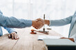 © Jirapong - Law, consultation, agreement, contract, lawyer or attorney shakes hands to agree on the client's offer to be hired to fight the parties in court.