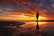 Leinwandbild Motiv silhouette person against background beautiful sunset sky on ocean, reflection rays sun and sky in water. Freedom inspiration in nature under open sky enjoys beautiful view and meditates, happiness