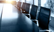 © xy - Conference table and chairs in empty meeting room
