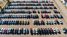 Aerial View Cars For Sale. Automotive Industry. Cars Dealership Parking Lot. Rows Of Brand New Vehicles Awaiting New Owners.