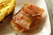 Breakfast dish. Open-Faced Sandwich  - Smoked ham with honey on toasted bread.