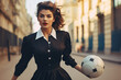 Fashionable 1950s woman playing football - soccer