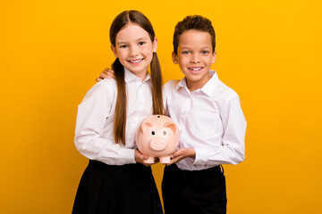 Sticker - Photo of two pupils schoolkid boy girl hold piggy bank save money for academic courses tuition isolated shine color background