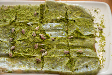 Delicious Turkish Traditional Dessert Katmer From Gaziantep - green pistachio, field of deph dessert food view, close up beautiful katmer photography