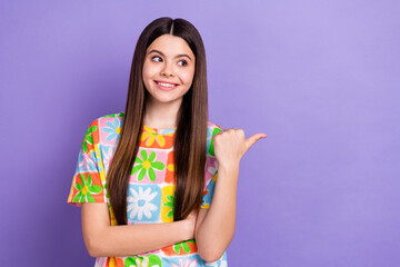 Poster - Photo of satisfied teen girl with long hairstyle dressed flower t-shirt look directing empty space isolated on violet color background