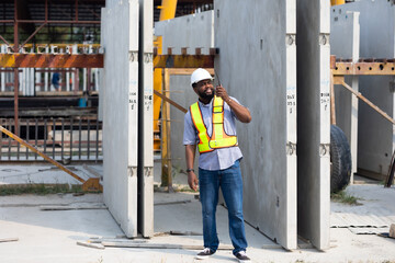 Wall Mural - Portrait African American professional Engineer factory. Engineering worker in safety hardhat at factory industrial facilities. Heavy Industry Manufacturing Factory. Prefabricated concrete walls