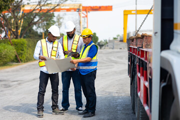 Wall Mural - Unity and teamwork concept. african american architect Engineering man in safety hardhat looking at blueprint at heavy Industry Manufacturing Factory. Prefabricated concrete walls