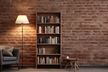 A Home Bookshelf With A Lamp And A Rug Is Located Against A Brick Wall.