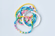© igishevamaria - Kids handmade beaded jewelry. Necklaces and bracelets made from multicolored beads and pearls. DIY bracelet beads. Children's needlework. Creativity and hobby. Art activity for kids