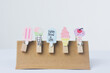 multicolored wooden clip on white background