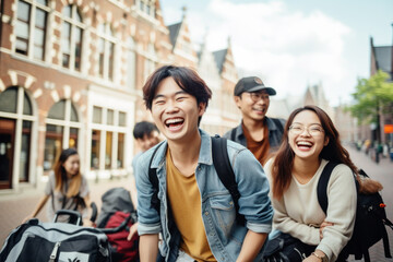 Happy group of young Japanese people with backpack riding a bike in Amsterdam. Life style concept with friends having fun together on summer holiday