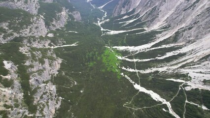 Wall Mural - Flying above a valley, Dolomites, Italy