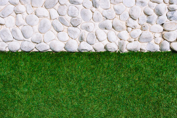 background green grass and a fence with white stone,there is a place for an inscription