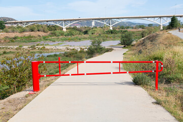 Red barrier to prevent the passage of vehicles.