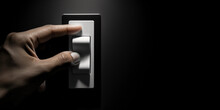 A Hand Turning Off The Light Switch, Emphasizing Energy Conservation, Dramatic Lighting