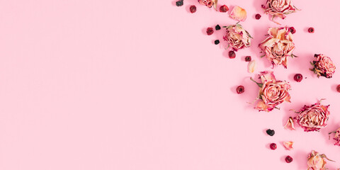 Wall Mural - autumn creative composition. dried rose flowers, berries, leaves on white background. autumn concept