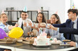 © Pixel-Shot - Group of business people drinking at birthday party in office
