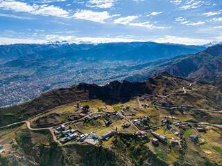 Wall Mural - Aerial view from the impressive landmark Muela del Diablo down into the valley with the highest capital and vibrant city La Paz and El Alto, Bolivia