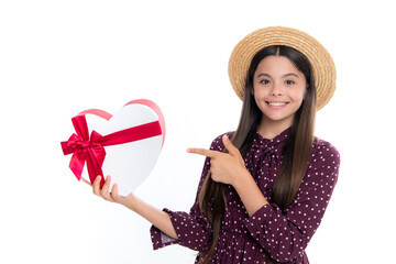 Poster - Summer kids sale. Child with gift present box on isolated studio background. Gifting for kids birthday. Portrait of happy smiling teenage girl.