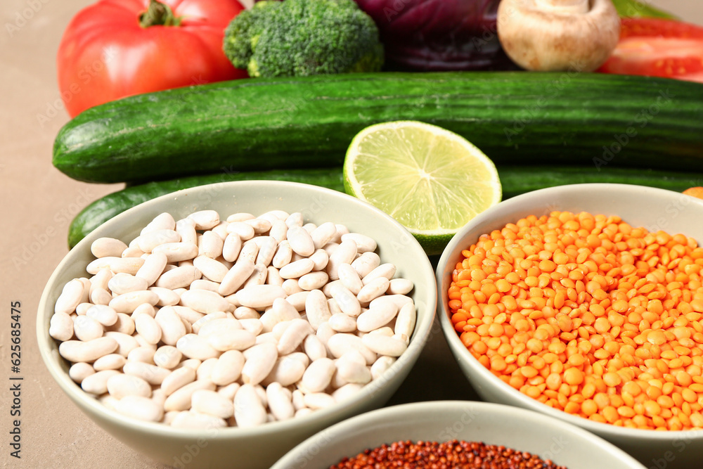 Different fresh vegetables and cereals on brown background, closeup