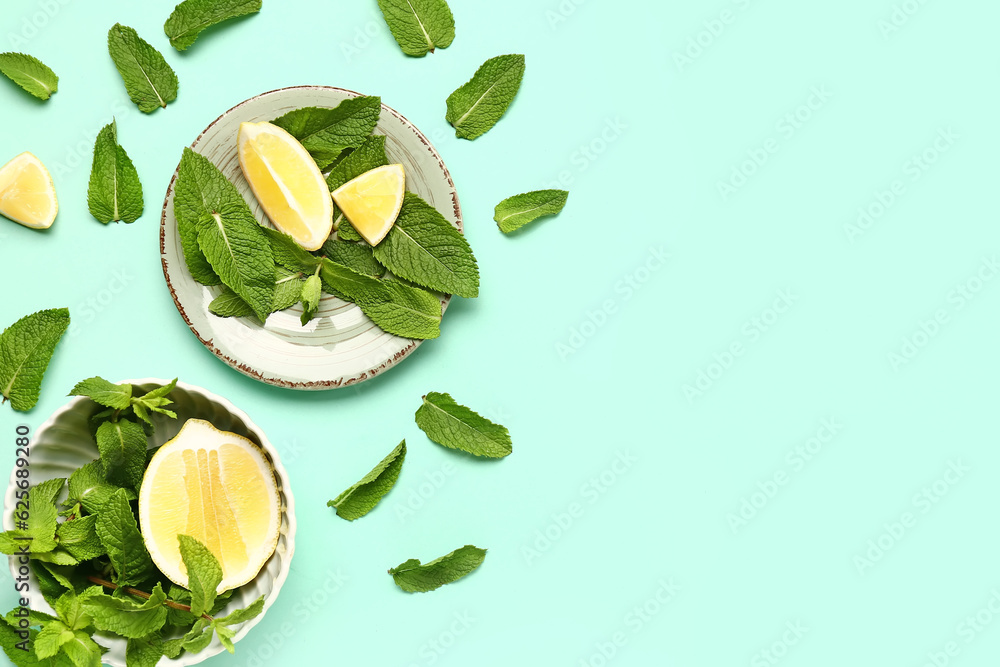 Composition with fresh mint leaves and lemons on color background