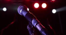 Close Up Of A Professional Vocal Wire Microphone On A Microphone Stand On Stage.
