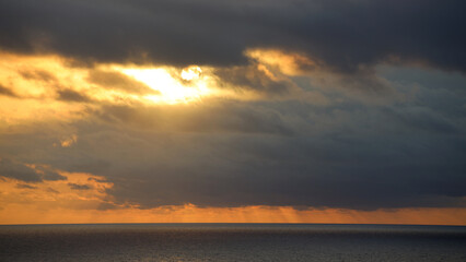 Wall Mural - Dark morning clouds somewhere over the Carabbean Sea