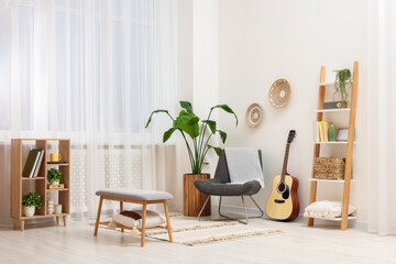 Wall Mural - Spring atmosphere. Stylish room interior with comfortable chair, houseplant and shelving unit