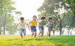 © Q88 - group image of asian children having fun in the park