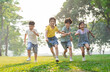 © Q88 - group image of asian children having fun in the park