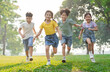 © Q88 - group image of asian children having fun in the park
