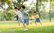 © Q88 - group image of asian children having fun in the park