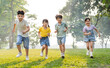 © Q88 - group image of asian children having fun in the park