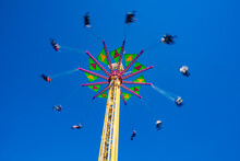 A Ride Spins In The Blue Sky At The North Carolina State Fair, Raleigh, North Carolina