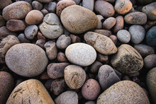 Smooth Brown And Grey Cobblestones On A Beach In Acadia, Maine