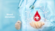 © iuriimotov - Blood Donation concept. World blood donor day awareness. Doctor holding in hand drop of blood with medical cross icon and medicine icons network connection on virtual screen. Vector illustration.